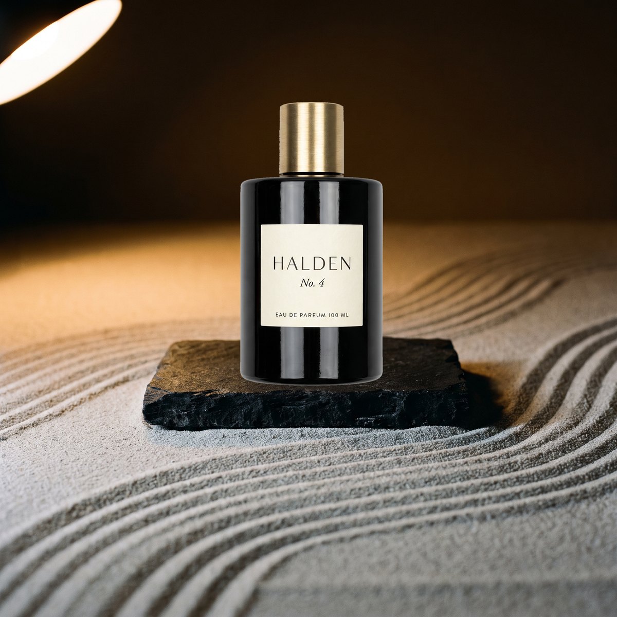A Halden No. 4 bottle pasted onto a dark sand set, still lit like a white studio